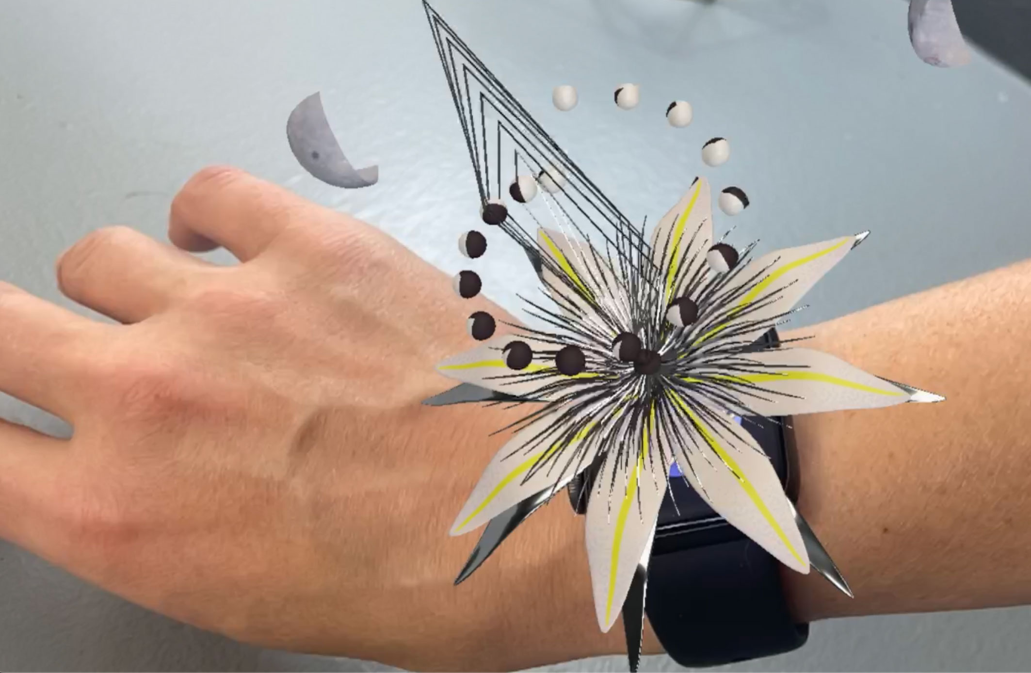 Full Moon Series — AR wearable showing the flower moon glowing on a wrist
